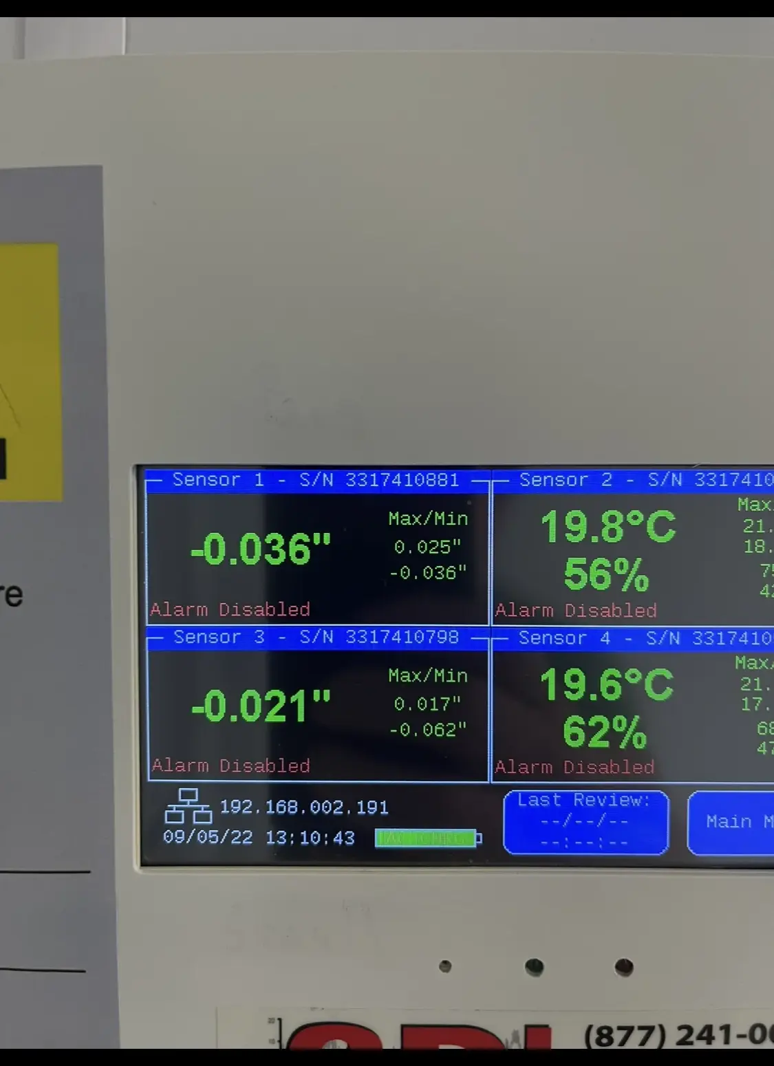 Cleanroom monitoring panel showing room pressure, temperature and humidity readouts