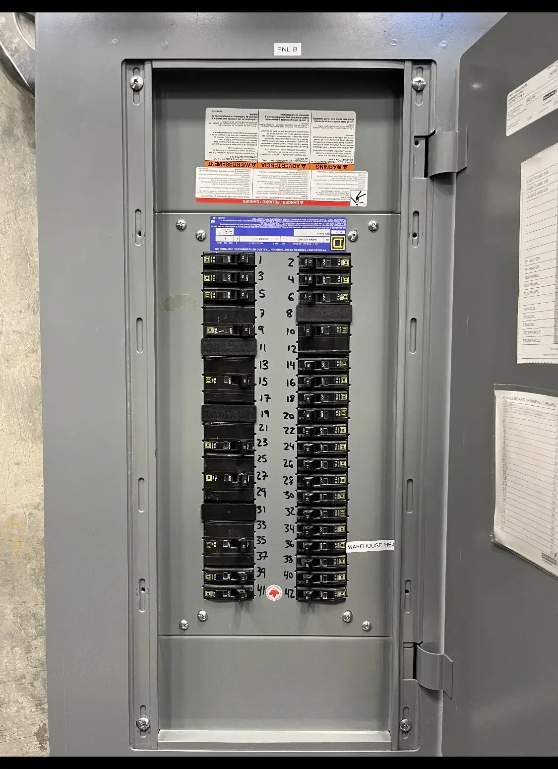 Panelboard with breakers and a typed circuit directory